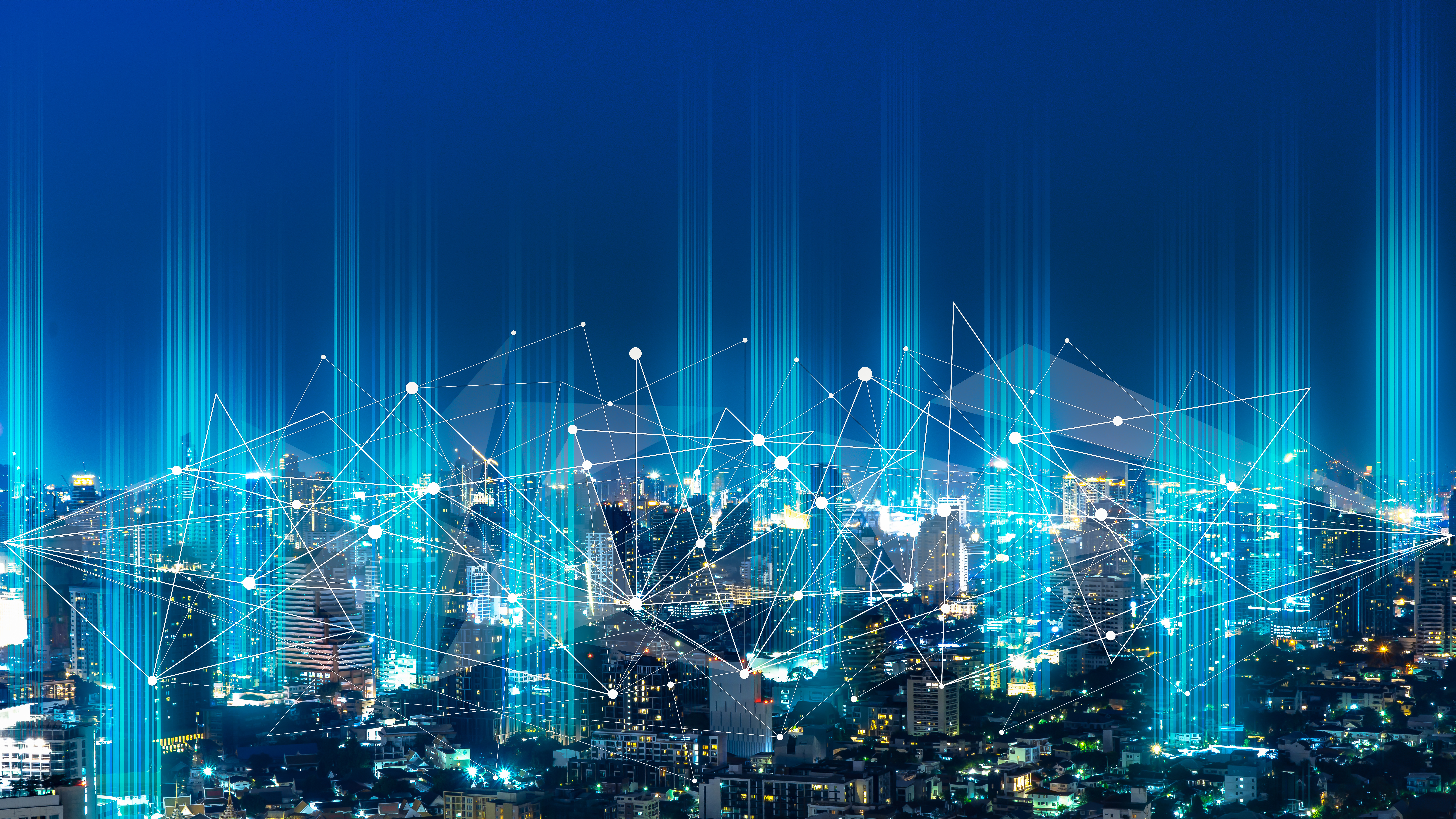 Digital network connections overlay across a city representing enterprise wireless connectivity and data flow