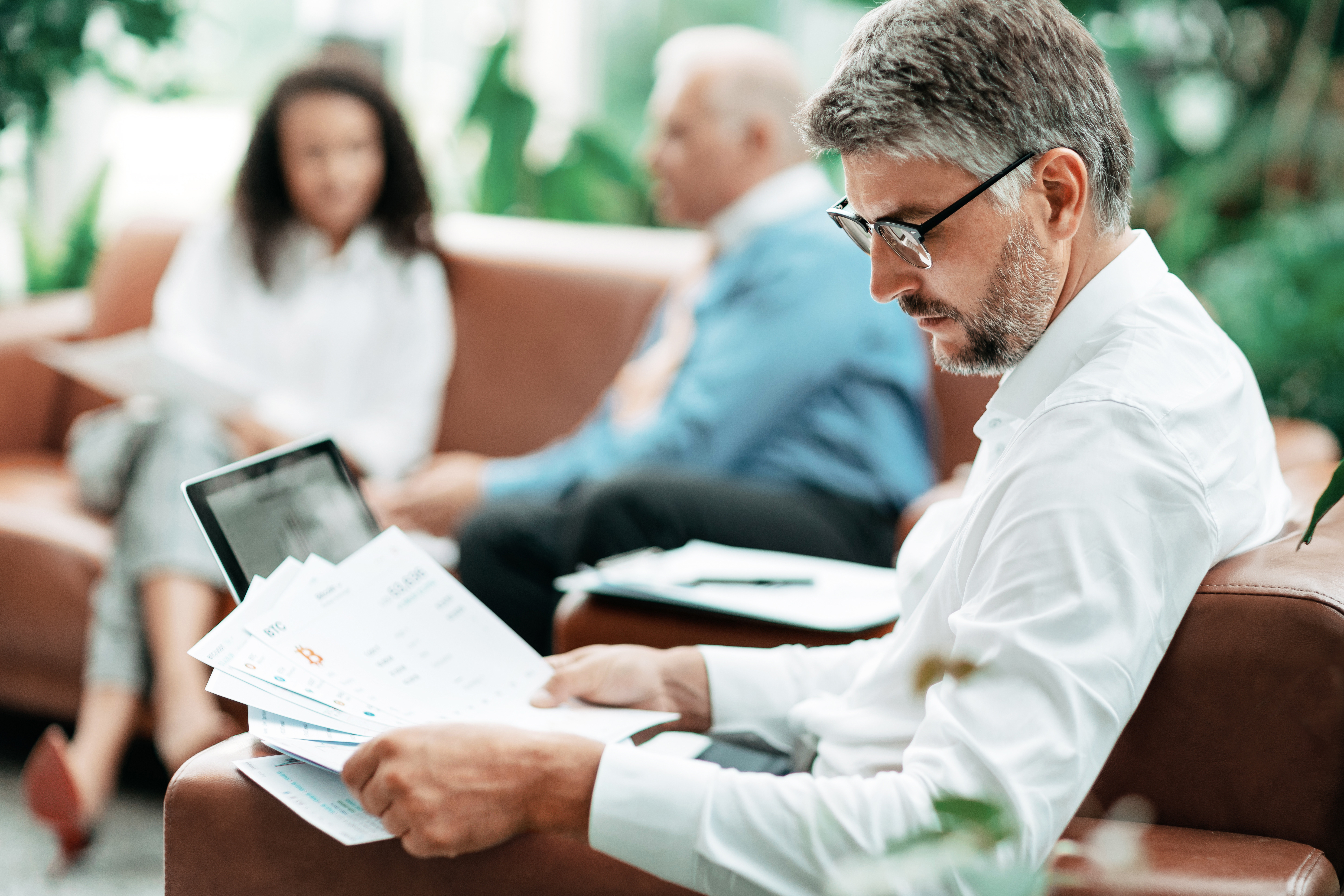 IT procurement professional reviewing managed services contract documents ahead of supplier renegotiation
