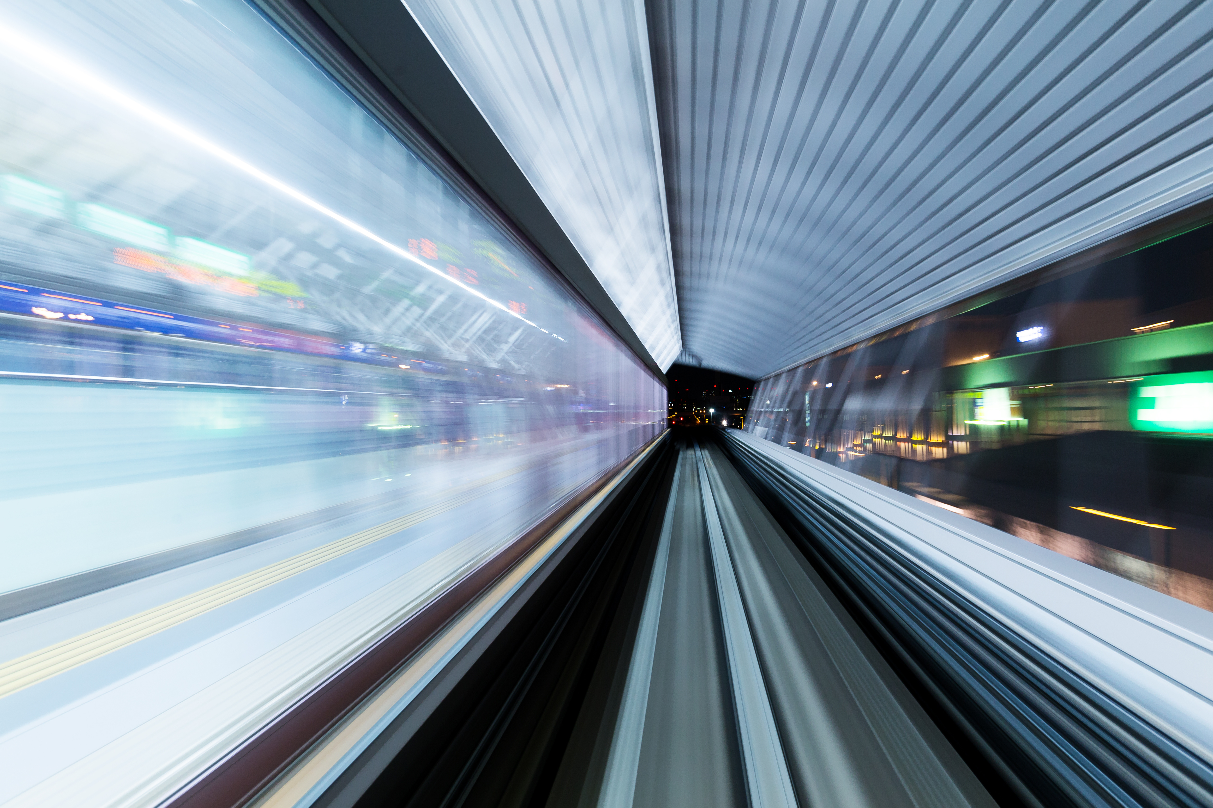 Motion-blurred train track converging to a dark vanishing point, representing the hidden buyer journey in AI-driven discovery