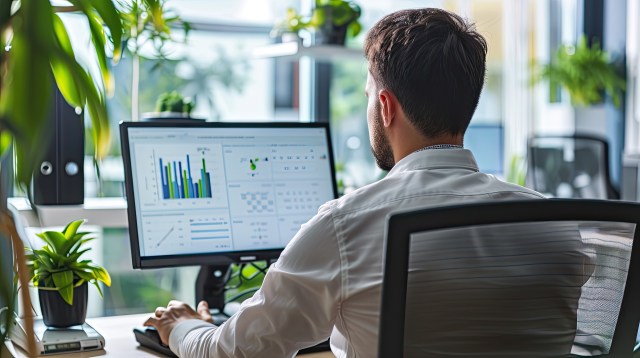 Business professional reviewing enterprise AI market intelligence and data analytics on screen